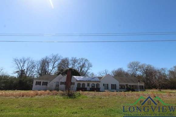 2.6 Acres of Residential Land with Home for Sale in Carthage, Texas