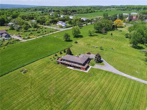 30.6 Acres of Agricultural Land with Home for Sale in Lansing, New York