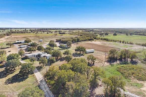 61.6 Acres of Agricultural Land with Home for Sale in Millsap, Texas