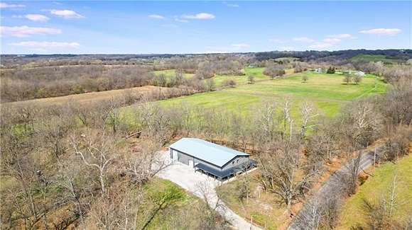 13.4 Acres of Land with Home for Sale in Lone Jack, Missouri
