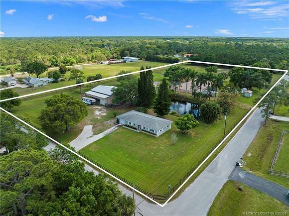 4.7 Acres of Residential Land with Home for Sale in Palm City, Florida