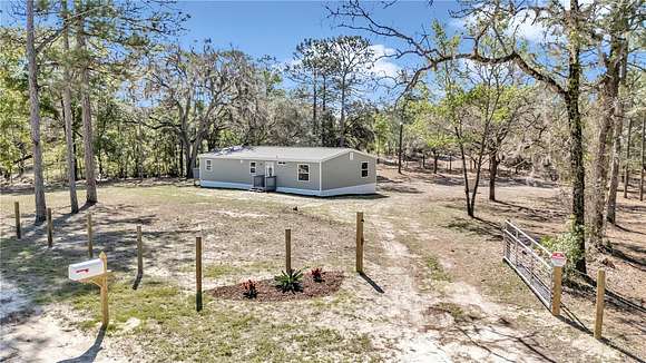 5.1 Acres of Land with Home for Sale in Bronson, Florida