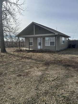 3.4 Acres of Residential Land with Home for Sale in Humansville, Missouri