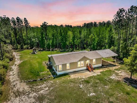 20 Acres of Recreational Land with Home for Sale in Chiefland, Florida