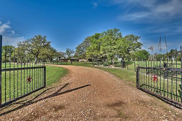 86.9 Acres of Agricultural Land with Home for Sale in Giddings, Texas
