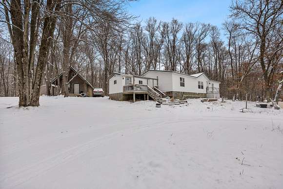 10 Acres of Land with Home for Sale in Chase, Michigan
