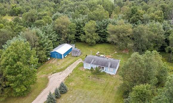 5.3 Acres of Residential Land with Home for Sale in Barryton, Michigan