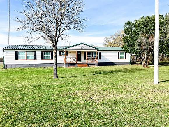 34.8 Acres of Land with Home for Sale in Honey Grove, Texas