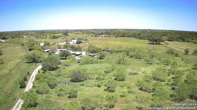 6.6 Acres of Residential Land with Home for Sale in Devine, Texas