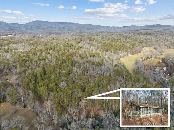 9.7 Acres of Residential Land with Home for Sale in Ellijay, Georgia