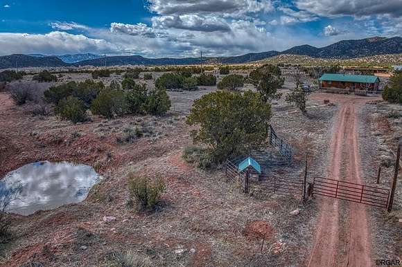 117.84 Acres of Agricultural Land with Home for Sale in Penrose, Colorado