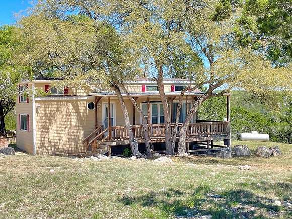 1.2 Acres of Residential Land with Home for Sale in Camp Wood, Texas