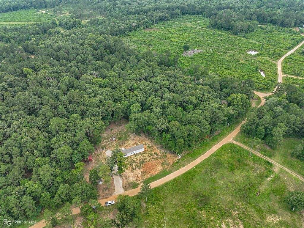 13.7 Acres of Land with Home for Sale in Oil City, Louisiana