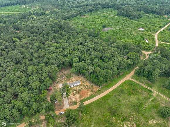 13.7 Acres of Land with Home for Sale in Oil City, Louisiana
