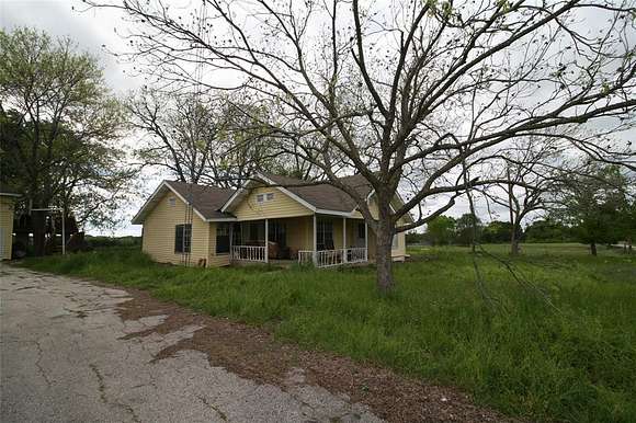 64.7 Acres of Agricultural Land with Home for Sale in Van, Texas