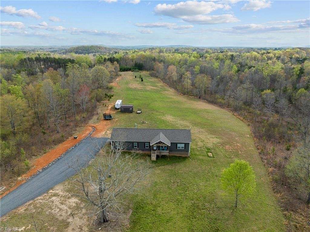 11.3 Acres of Land with Home for Sale in Stoneville, North Carolina