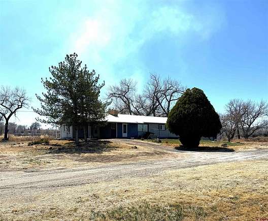 126.8 Acres of Agricultural Land with Home for Sale in Delta, Colorado