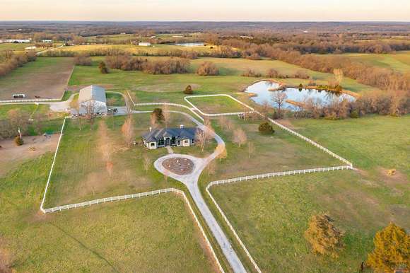80 Acres of Agricultural Land with Home for Sale in Clinton, Missouri