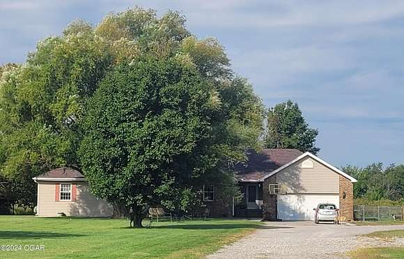 8.7 Acres of Residential Land with Home for Sale in Columbus, Kansas