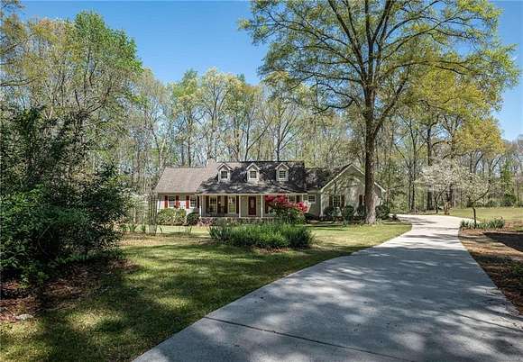 6.7 Acres of Land with Home for Sale in McDonough, Georgia