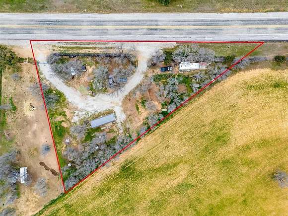 1 Acre of Residential Land with Home for Sale in Santo, Texas