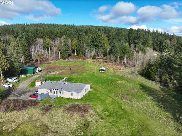 5.1 Acres of Residential Land with Home for Sale in Kelso, Washington