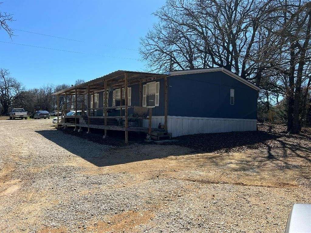 5 Acres of Residential Land with Home for Sale in Blum, Texas