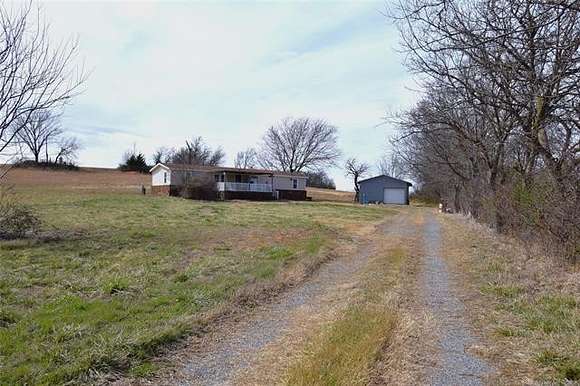 20 Acres of Agricultural Land with Home for Sale in Chouteau, Oklahoma
