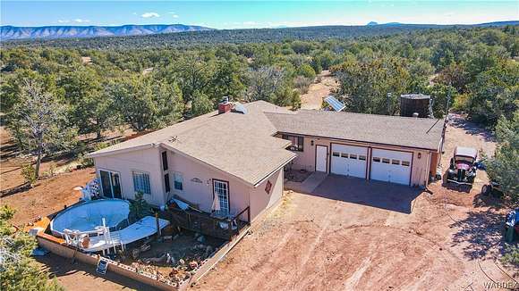 6.89 Acres of Land with Home for Sale in Seligman, Arizona