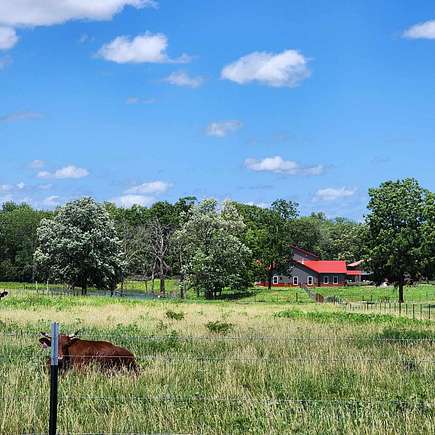 180 Acres of Agricultural Land with Home for Sale in Calhoun, Missouri