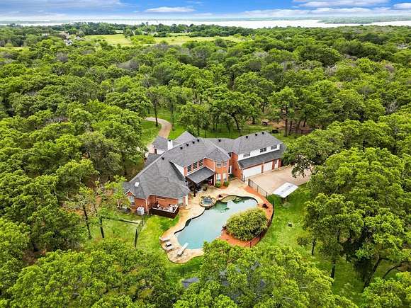 5.1 Acres of Land with Home for Sale in Oak Point, Texas