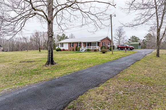 9 Acres of Residential Land with Home for Sale in Holladay, Tennessee