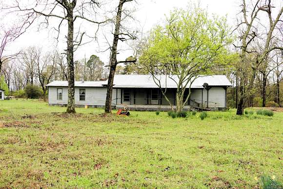 2.477 Acres of Residential Land with Home for Sale in Avinger, Texas