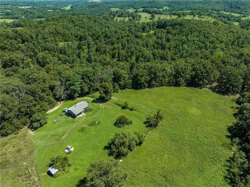 120 Acres of Land with Home for Sale in Seligman, Missouri