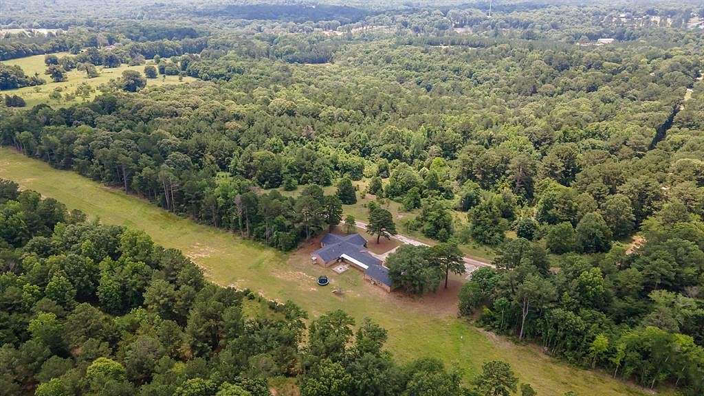 57.8 Acres of Land with Home for Sale in Overton, Texas