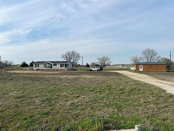 5 Acres of Residential Land with Home for Sale in Gainesville, Texas
