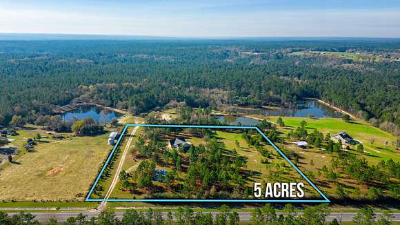 5 Acres of Residential Land with Home for Sale in Baker, Florida