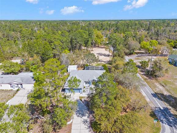 2.4 Acres of Residential Land with Home for Sale in Weeki Wachee, Florida