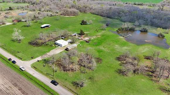 15.2 Acres of Land with Home for Sale in Commerce, Texas