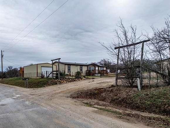 15 Acres of Land with Home for Sale in Poolville, Texas
