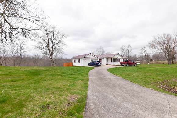 6.7 Acres of Residential Land with Home for Sale in Olive Hill, Kentucky