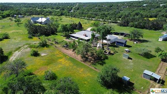 10.9 Acres of Land with Home for Sale in Driftwood, Texas