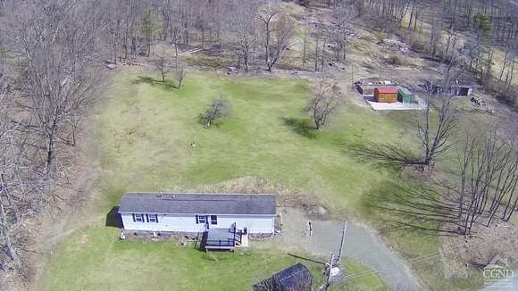 74.2 Acres of Recreational Land with Home for Sale in East Nassau, New York