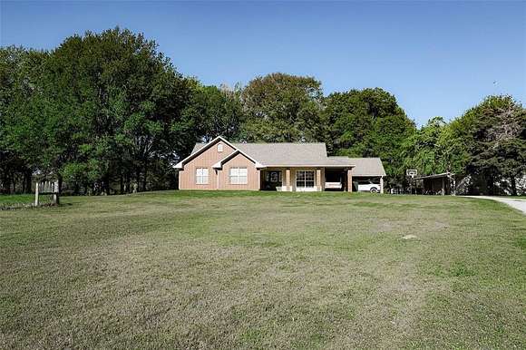 11.91 Acres of Land with Home for Sale in Bonham, Texas