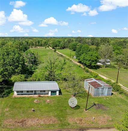 5 Acres of Residential Land with Home for Sale in Powderly, Texas