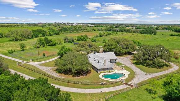 77 Acres of Agricultural Land with Home for Sale in Granbury, Texas