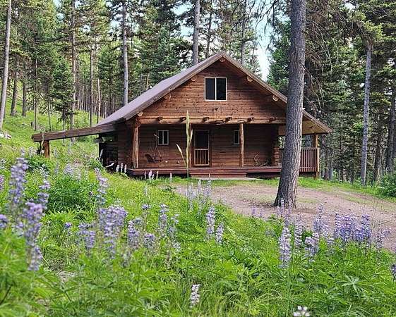 6 Acres of Residential Land with Home for Sale in Seeley Lake, Montana