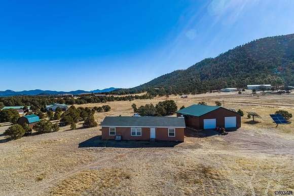 5.4 Acres of Residential Land with Home for Sale in Cotopaxi, Colorado