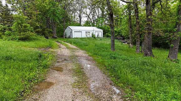 6.5 Acres of Residential Land with Home for Sale in Mansfield, Missouri