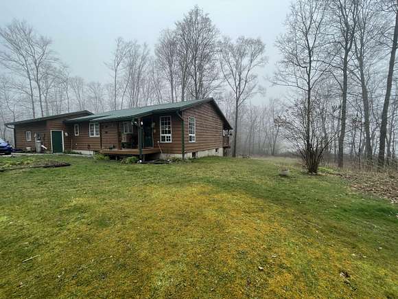 65 Acres of Recreational Land with Home for Sale in Hessel, Michigan